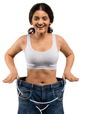 slimming-concept-slim-indian-woman-wearing-oversized-jeans-posing-beige-background-Photoroom-1-e1755963481141.png